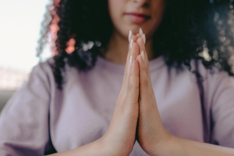 a praying hands close up photo